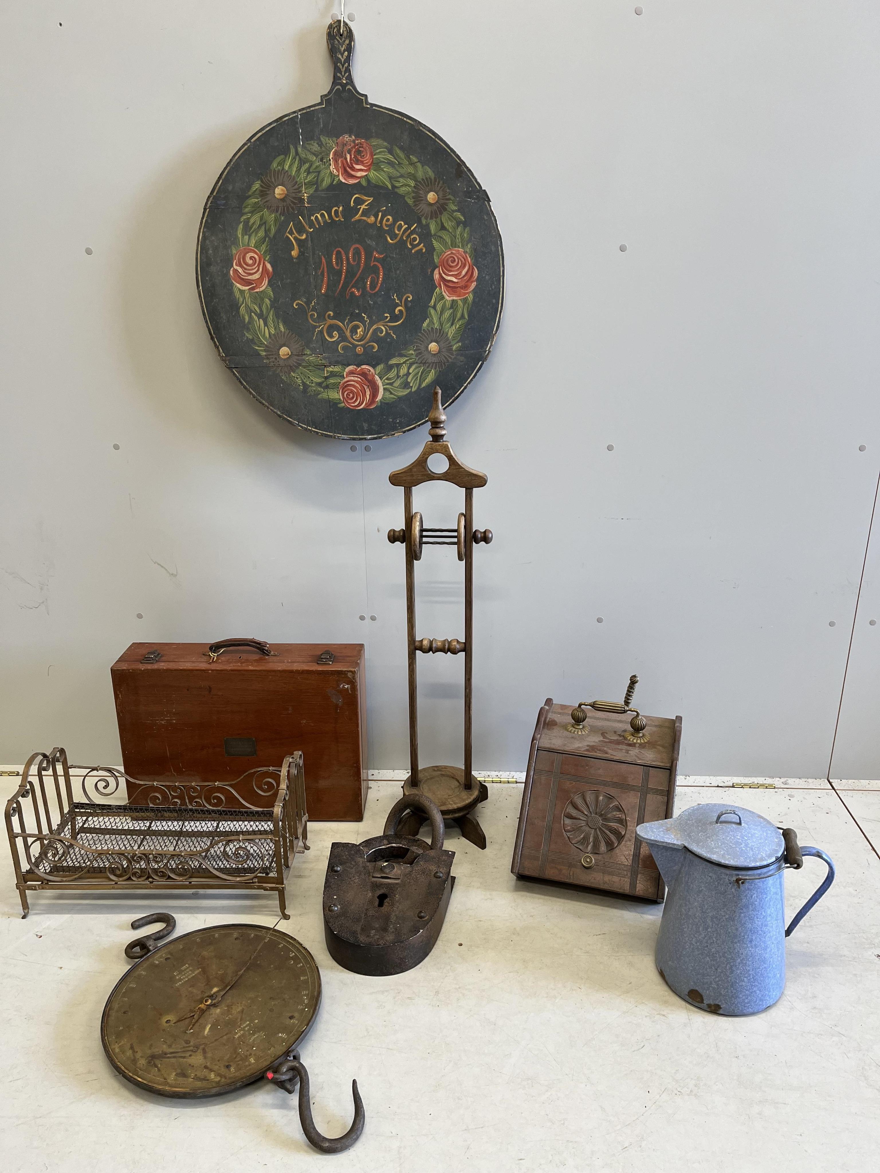 A late Victorian brass mounted mahogany coal scuttle, a large faux iron model of a padlock, a thread stand, scales and sundries